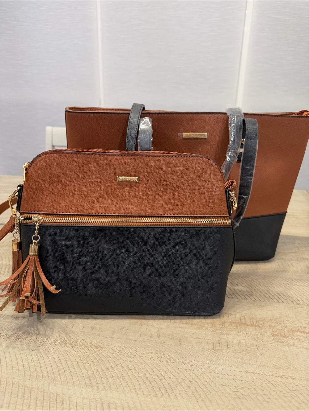 Two-Tone Brown and Black Crossbody Bag with Tassel Accent